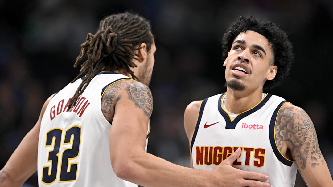 Jan 12, 2025; Dallas, Texas, USA; Denver Nuggets forward Aaron Gordon (32) and guard Julian Strawther (3) celebrate during the second quarter against the Dallas Mavericks at the American Airlines Center.