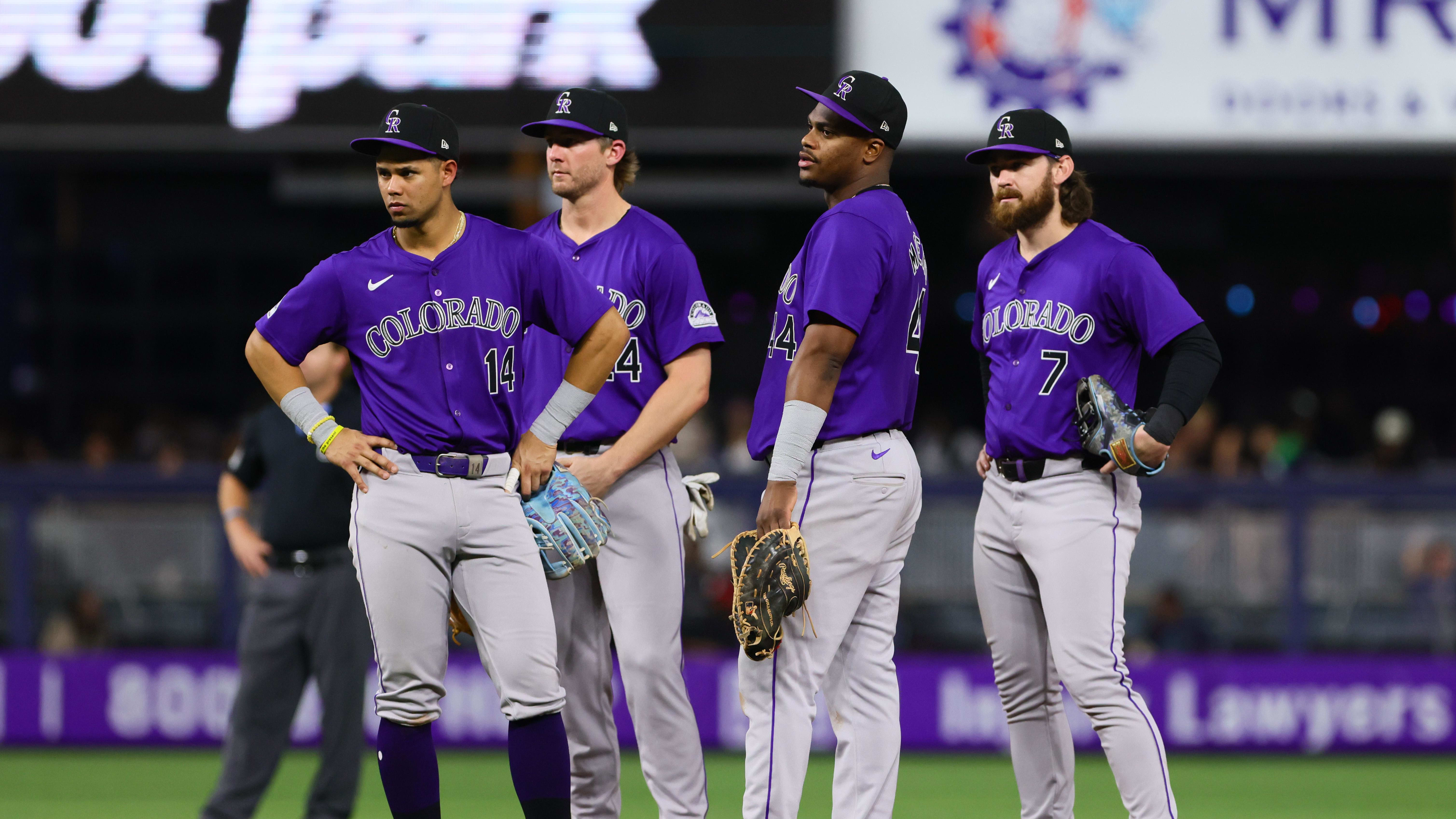 May 1, 2024; Miami, Florida, USA; Colorado Rockies infielders gather during a pitching change.
