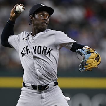 Sep 2, 2024; Arlington, Texas, USA; New York Yankees third baseman Jazz Chisholm Jr. (13) throws to first base during the second inning at Globe Life Field. Mandatory Credit: Jerome Miron-USA TODAY Sports