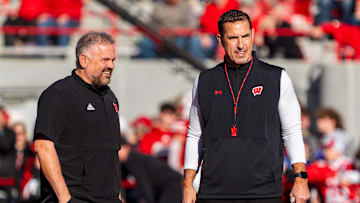 Nov 23, 2024; Lincoln, Nebraska, USA; Nebraska Cornhuskers head coach Matt Rhule and Wisconsin Badgers head coach Luke Fickell talk before a game at Memorial Stadium. Mandatory Credit: Dylan Widger-Imagn Images