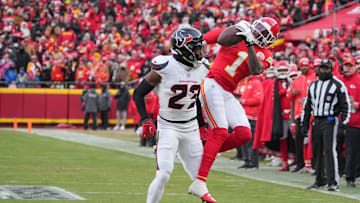 Jan 18, 2025; Kansas City, Missouri, USA; Kansas City Chiefs wide receiver Xavier Worthy (1) catches a pass as Houston Texans safety Eric Murray (23) defends during the first half of a 2025 AFC divisional round game at GEHA Field at Arrowhead Stadium. 
