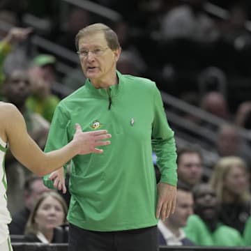 Mar 21, 2025; Seattle, WA, USA; Oregon Ducks head coach Dana Altman reacts with guard Jackson Shelstad (3) during the second half in the first round of the NCAA Tournament  at Climate Pledge Arena. Mandatory Credit: Stephen Brashear-Imagn Images