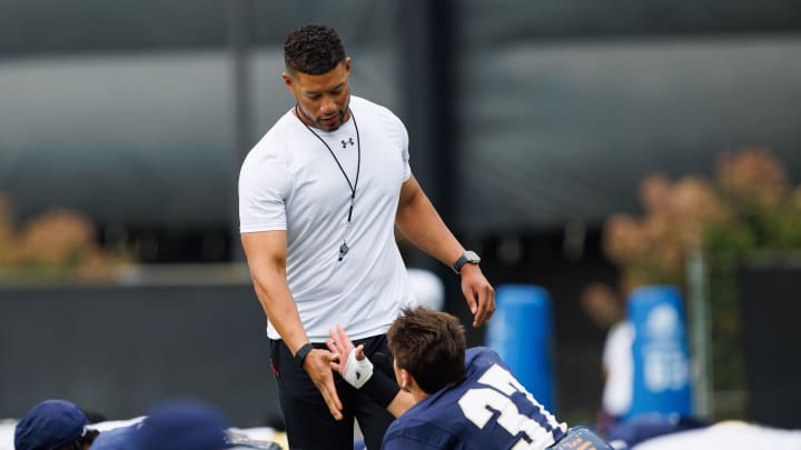 Notre Dame head coach Marcus Freeman greets corner back Max Hurleman (37) during a Notre Dame football practice at Irish Athletic Center on Tuesday, Aug. 6, 2024, in South Bend.