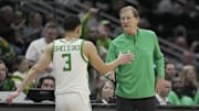 Mar 21, 2025; Seattle, WA, USA; Oregon Ducks head coach Dana Altman reacts with guard Jackson Shelstad (3) during the second half in the first round of the NCAA Tournament  at Climate Pledge Arena. 