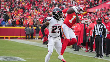 Jan 18, 2025; Kansas City, Missouri, USA; Kansas City Chiefs wide receiver Xavier Worthy (1) catches a pass as Houston Texans safety Eric Murray (23) defends during the first half of a 2025 AFC divisional round game at GEHA Field at Arrowhead Stadium. Mandatory Credit: Denny Medley-Imagn Images