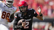 Oct 4, 2025; Cincinnati, Ohio, USA;  Cincinnati Bearcats quarterback Brendan Sorsby (2) runs with the ball against the Iowa State Cyclones in the first half at Nippert Stadium. Mandatory Credit: Aaron Doster-Imagn Images