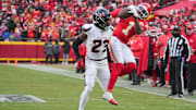 Jan 18, 2025; Kansas City, Missouri, USA; Kansas City Chiefs wide receiver Xavier Worthy (1) catches a pass as Houston Texans safety Eric Murray (23) defends during the first half of a 2025 AFC divisional round game at GEHA Field at Arrowhead Stadium. Mandatory Credit: Denny Medley-Imagn Images