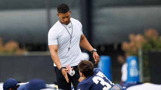 Marcus Freeman greets Notre Dame football players in pre-practice on Aug. 6, 2024.