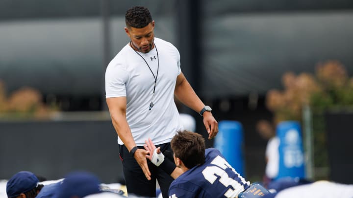 Notre Dame head coach Marcus Freeman greets corner back Max Hurleman (37) during a Notre Dame football practice at Irish Athletic Center on Tuesday, Aug. 6, 2024, in South Bend.