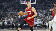 Apr 20, 2025; Cleveland, Ohio, USA; Miami Heat forward Duncan Robinson (55) dribbles the ball in the first quarter against the Cleveland Cavaliers at Rocket Arena. Mandatory Credit: David Richard-Imagn Images