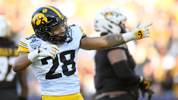 Dec 30, 2024; Nashville, TN, USA;  Iowa Hawkeyes running back Kamari Moulton (28) celebrates his first down against the Missouri Tigers during the first half at Nissan Stadium. Mandatory Credit: Steve Roberts-Imagn Images