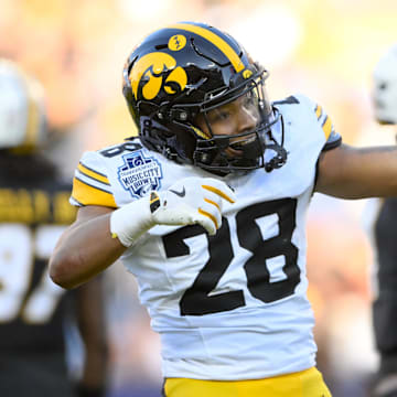 Dec 30, 2024; Nashville, TN, USA;  Iowa Hawkeyes running back Kamari Moulton (28) celebrates his first down against the Missouri Tigers during the first half at Nissan Stadium. Mandatory Credit: Steve Roberts-Imagn Images