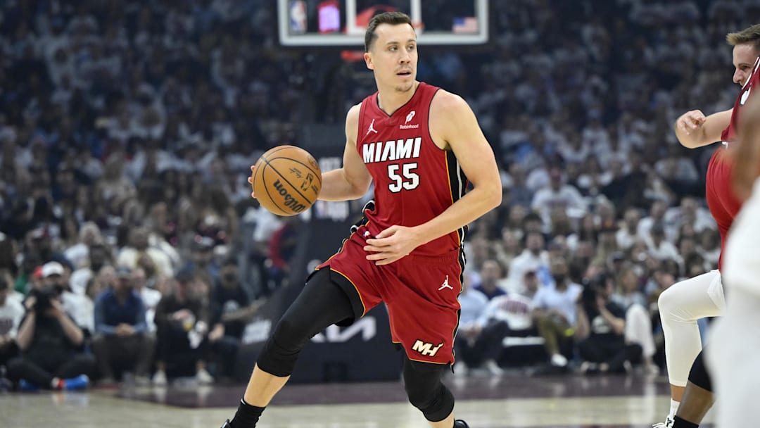 Apr 20, 2025; Cleveland, Ohio, USA; Miami Heat forward Duncan Robinson (55) dribbles the ball in the first quarter against the Cleveland Cavaliers at Rocket Arena. Mandatory Credit: David Richard-Imagn Images