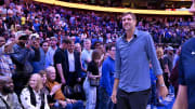 Mar 13, 2024; Dallas, Texas, USA; Former NBA player Dirk Nowitzki walks off the court after the game between the Dallas Mavericks and the Golden State Warriors at the American Airlines Center. Mandatory Credit: Jerome Miron-USA TODAY Sports