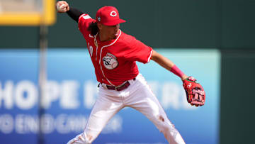 Cincinnati Reds shortstop Edwin Arroyo throws to first base