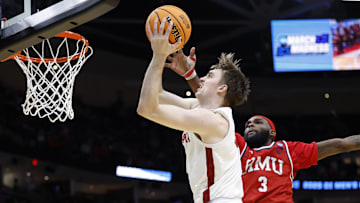 Mar 21, 2025; Cleveland, OH, USA; Alabama Crimson Tide forward Grant Nelson (4) goes to the basket defended by Robert Morris Colonials guard Amarion Dickerson (3) in the second half  during the NCAA Tournament First Round at Rocket Arena. Mandatory Credit: Rick Osentoski-Imagn Images