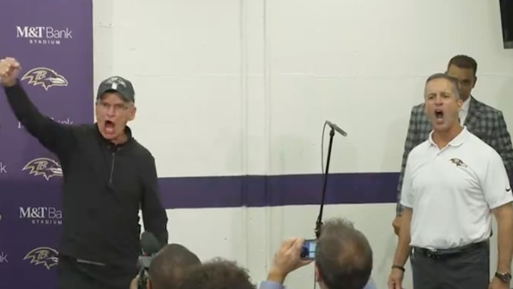 Jack and John Harbaugh address the Baltimore Ravens after the game against the Buffalo Bills.