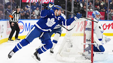 Jan 20, 2025; Toronto, Ontario, CAN; Toronto Maple Leafs center Auston Matthews (34) attempts a wrap around with the puck on Tampa Bay Lightning goaltender Jonas Johansson (31) during the third period at Scotiabank Arena. Mandatory Credit: Nick Turchiaro-Imagn Images