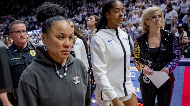 Jan 25, 2024; Baton Rouge, Louisiana, USA; South Carolina Gamecocks head coach Dawn Staley, left, walks past LSU Lady Tigers head coach Kim Mulkey after South Carolina   s victory at Pete Maravich Assembly Center. Mandatory Credit: Matthew Hinton-Imagn Images