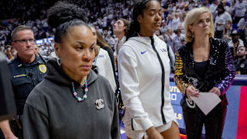 Jan 25, 2024; Baton Rouge, Louisiana, USA; South Carolina Gamecocks head coach Dawn Staley, left, walks past LSU Lady Tigers head coach Kim Mulkey after South Carolina   s victory at Pete Maravich Assembly Center. Mandatory Credit: Matthew Hinton-Imagn Images