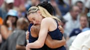 Apr 6, 2025; Tampa, FL, USA; Connecticut Huskies guard Paige Bueckers (5) and guard KK Arnold (2) hug during the second half against the South Carolina Gamecocks of the national championship of the women's 2025 NCAA tournament at Amalie Arena. Mandatory Credit: Kirby Lee-Imagn Images