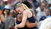 Connecticut Huskies guard Paige Bueckers (5) and guard KK Arnold (2) hug during the second half against the South Carolina Gamecocks of the national championship of the women's 2025 NCAA tournament at Amalie Arena.