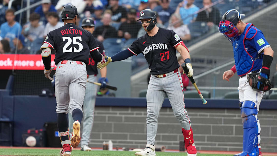 Aug 27, 2025; Toronto, Ontario, CAN; Minnesota Twins centre fielder Byron Buxton (25) hits a home run and celibates with catcher Ryan Jeffers (27) against the Toronto Blue Jays during the first inning at Rogers Centre. Aug 27, 2025; Toronto, Ontario, CAN; Minnesota Twins centre fielder Byron Buxton (25) hits a home run and celibates with catcher Ryan Jeffers (27) against the Toronto Blue Jays during the first inning at Rogers Centre.