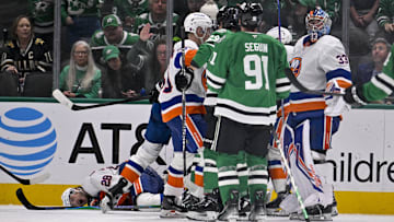 Nov 18, 2025; Dallas, Texas, USA; Dallas Stars right wing Mikko Rantanen (96) is called for a game misconduct penalty for boarding on New York Islanders defenseman Alexander Romanov (28) during the third period at the American Airlines Center. Mandatory Credit: Jerome Miron-Imagn Images