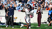 Oct 25, 2025; Chapel Hill, North Carolina, USA; Virginia Cavaliers wide receiver Trell Harris (11) breaks a tackle and scores a touchdown in the second quarer at Kenan Stadium. Mandatory Credit: Bob Donnan-Imagn Images