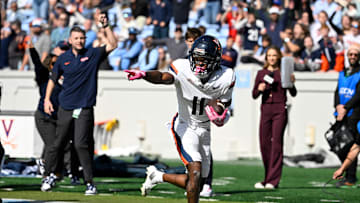 Oct 25, 2025; Chapel Hill, North Carolina, USA; Virginia Cavaliers wide receiver Trell Harris (11) breaks a tackle and scores a touchdown in the second quarer at Kenan Stadium. Mandatory Credit: Bob Donnan-Imagn Images