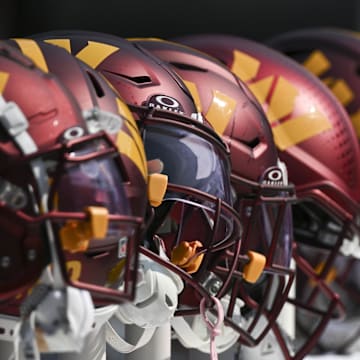 Oct 13, 2024; Baltimore, Maryland, USA;  Washington Commanders helmets like the bench during the firxt half against the Baltimore Ravens at M&T Bank Stadium. Mandatory Credit: Tommy Gilligan-Imagn Images