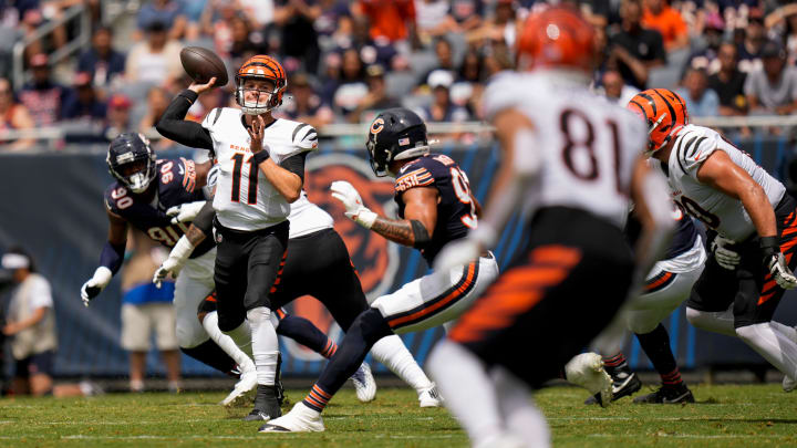 Cincinnati Bengals quarterback Logan Woodside (11) throws a deep pass to wide receiver Jermaine Burton (81) in the first quarter of the NFL Preseason Week 2 game between the Chicago Bears and the Cincinnati Bengals at Soldier Field in downtown Chicago on Saturday, Aug. 17, 2024. The Bears led 10-3 at halftime.