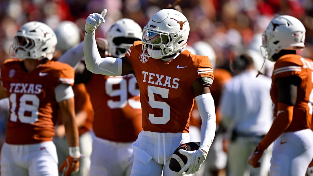 Texas Longhorns defensive back Malik Muhammad (5) celebrates after he intercepts a pass thrown by Oklahoma Sooners quarterback John Mateer