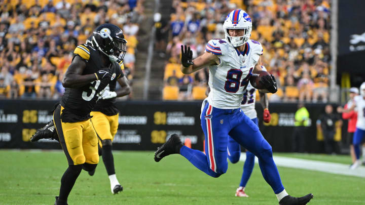 Aug 17, 2024; Pittsburgh, Pennsylvania, USA;  Buffalo Bills tight end Zach Davidson (84) runs against Pittsburgh Steelers safety Jalen Elliott (34) during the second quarter at Acrisure Stadium. 