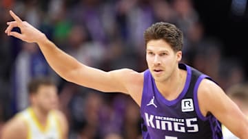 Dec 8, 2024; Sacramento, California, USA; Sacramento Kings forward Doug McDermott (7) gestures after making a three point basket against the Utah Jazz during the fourth quarter at Golden 1 Center. Mandatory Credit: Darren Yamashita-Imagn Images
