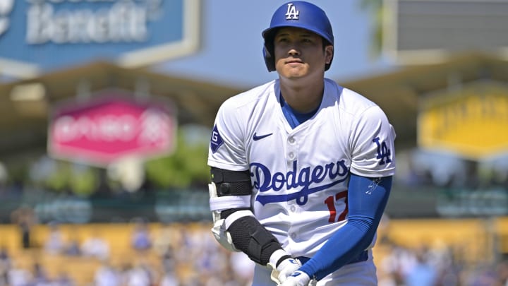 Aug 25, 2024; Los Angeles, California, USA;  Los Angeles Dodgers designated hitter Shohei Ohtani (17) clutches his wrist after he was hit by a pitch in the eighth inning against the Tampa Bay Rays at Dodger Stadium. Mandatory Credit: Jayne Kamin-Oncea-USA TODAY Sports