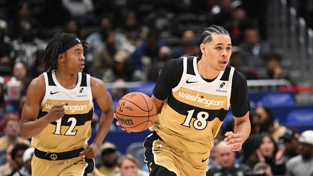 Nov 16, 2025; Washington, District of Columbia, USA;  Washington Wizards forward Kyshawn George (18) dribbles the ball up court against the Brooklyn Nets during the fourth quarter at Capital One Arena. Mandatory Credit: Rafael Suanes-Imagn Images