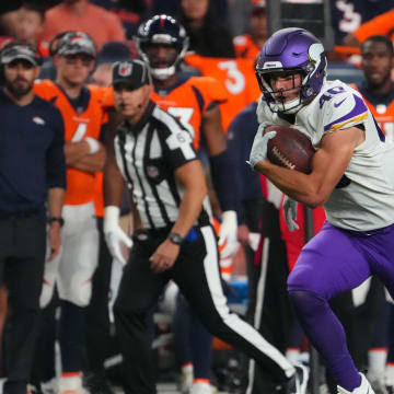 Aug 27, 2022; Denver, Colorado, USA; Minnesota Vikings tight end Zach Davidson (40) carries the ball against the Denver Broncos in the second half at Empower Field at Mile High.  