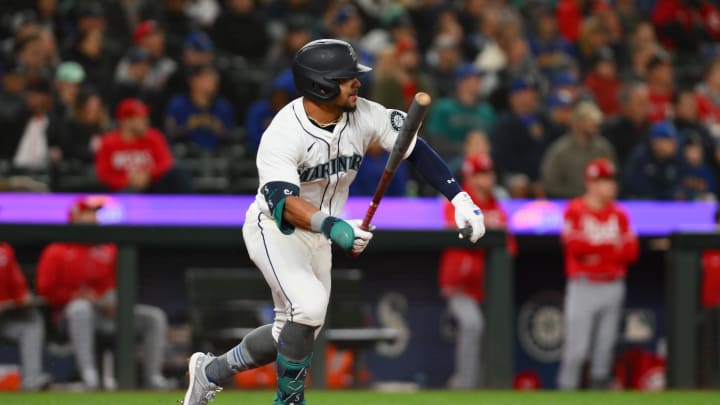 Seattle Mariners left fielder Jonatan Clase runs towards first base after hitting his first career MLB hit during the sixth inning against the Cincinnati Reds at T-Mobile Park. All players wore #42 in honor of Jackie Robinson Day on April 15.