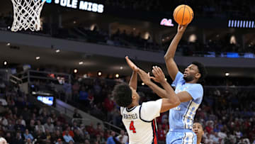 Mar 21, 2025; Milwaukee, WI, USA; North Carolina Tar Heels forward Jalen Washington (13) shoots against Mississippi Rebels forward Jaemyn Brakefield (4) during the second half of a first round NCAA men’s tournament game at Fiserv Forum. Mandatory Credit: Jeff Hanisch-Imagn Images