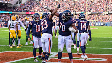 Nov 17, 2024; Chicago, Illinois, USA; Chicago Bears running back Roschon Johnson (23) celebrates his rushing touchdown with offensive tackle Braxton Jones (70) against the Green Bay Packers during the second quarter at Soldier Field. Mandatory Credit: Daniel Bartel-Imagn Images