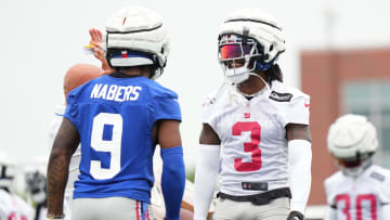 Jul 25, 2024; East Rutherford, NY, USA; New York Giants wide receiver Malik Nabers (9) and cornerback Deonte Banks (3) react after a drill during training camp at Quest Diagnostics Training Center.  