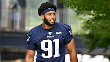 Jun 9, 2025; Foxborough, MA, USA; New England Patriots edge Elijah Ponder (91) walks to the practice fields at Gillette Stadium. Mandatory Credit: Eric Canha-Imagn Images