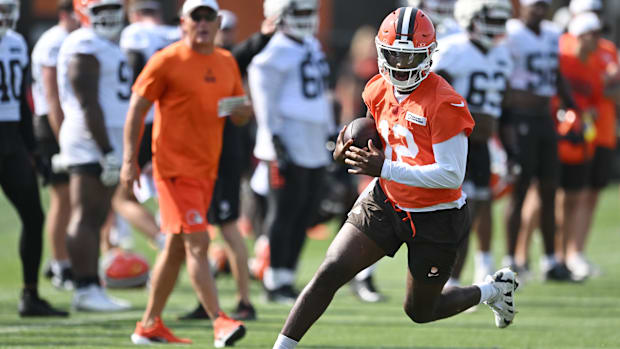 Cleveland Browns quarterback Shedeur Sanders (12) scrambles during training camp at CrossCountry Mortgage Campus.