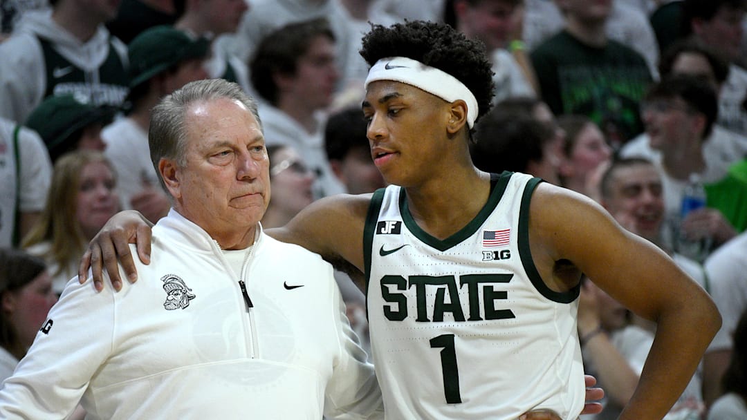 Michigan State Spartans head coach Tom Izzo huddles with Michigan State Spartans guard Jeremy Fears Jr. (1) during the second half against the Michigan Wolverines at Jack Breslin Student Events Center. 
