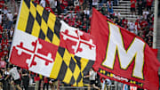 Oct 11, 2025; College Park, Maryland, USA;  Maryland state and Maryland Terrapins school flags on display after a touchdown  during the game against the Nebraska Cornhuskers at SECU Stadium. Mandatory Credit: Tommy Gilligan-Imagn Images