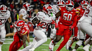 Nov 1, 2025; College Park, Maryland, USA;  Indiana Hoosiers running back Khobie Martin (28) rushes by Maryland Terrapins linebacker Carlton Smith (32) during the second half at SECU Stadium. Mandatory Credit: Tommy Gilligan-Imagn Images