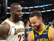 Jan 27, 2024; San Francisco, California, USA; Los Angeles Lakers forward LeBron James (23) and Golden State Warriors guard Stephen Curry (right) talk after the game at Chase Center. Mandatory Credit: Darren Yamashita-USA TODAY Sports