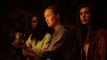 L-R: Nia Sondaya as Teen Akilah, Liv Hewson as Teen Van and Sophie Nélisse as Teen Shauna in Yellowjackets, episode 3, season 3, streaming on Paramount+ with SHOWTIME, 2025. Photo Credit: Kailey Schwerman/Paramount+ with SHOWTIME.