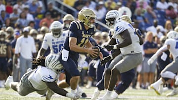 Sep 21, 2024; Annapolis, Maryland, USA;  Memphis Tigers defensive lineman Javon Denis (8) sacks Navy Midshipmen quarterback Blake Horvath (11) during the first half at Navy-Marine Corps Memorial Stadium. Mandatory Credit: Tommy Gilligan-Imagn Images